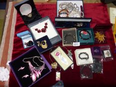 A box of costume jewellery including dress rings, bookmarks Poppy necklace, beaded bracelets etc.