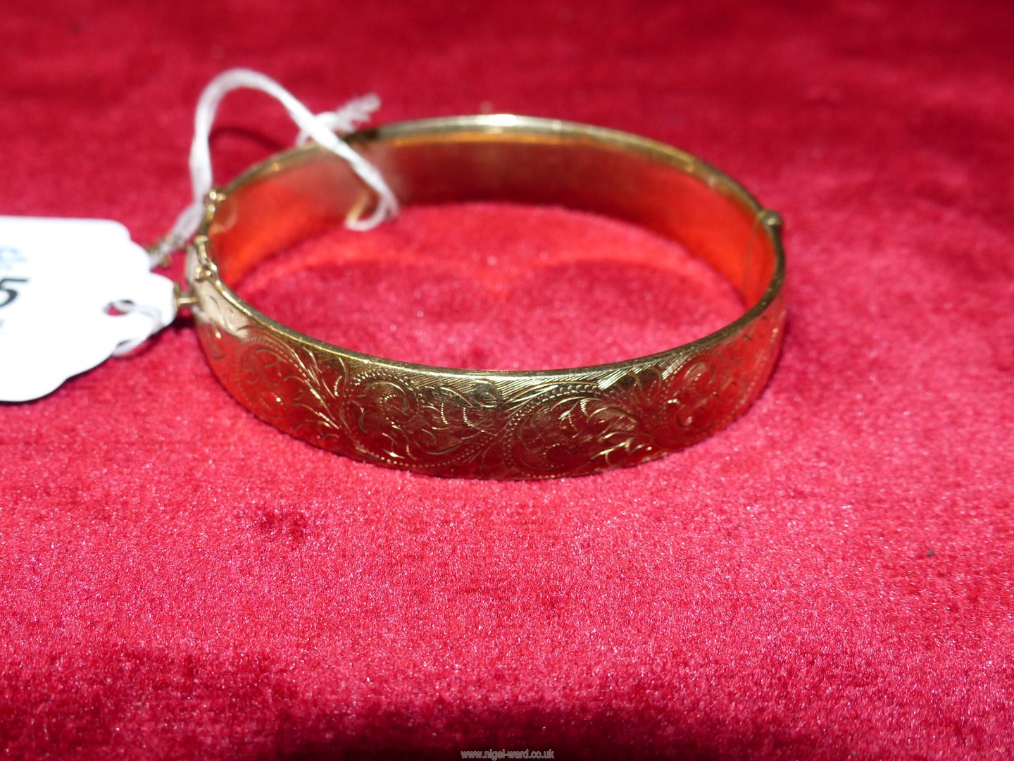 A plated 1/5th 9ct gold metal core Bangle with engraved foliate design. - Image 4 of 4