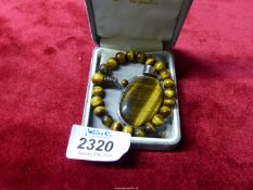 Three pieces of Tiger Eye jewellery including large pendant in 925 silver mount,
