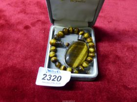 Three pieces of Tiger Eye jewellery including large pendant in 925 silver mount,