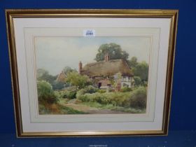 A Henry John Sylvester Stannard RBA RSA (British 1870-1951) Watercolour of a thatched cottage in a