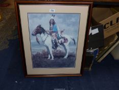 A large framed and mounted Print of a Native American Indian on his horse by Howard Terpning titled