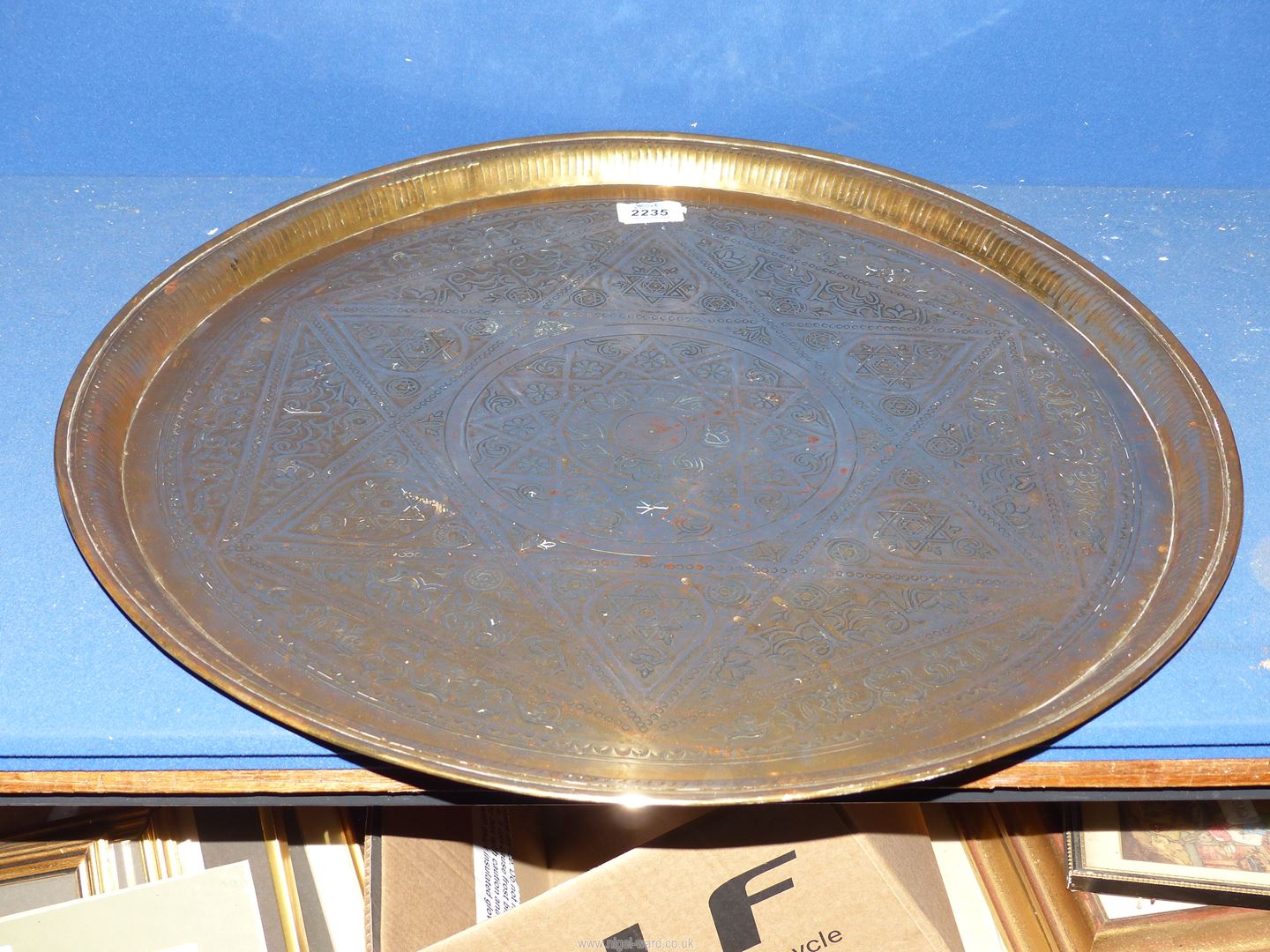 A large brass hand beaten Benares tray with Arabic script and designs, of some age, 23" diameter. - Image 2 of 2