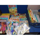 A small case and a box of children's annuals and comics including Battle Annuals, Tomahawk, Batman,