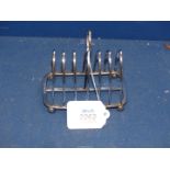 A Silver Toast rack on ball feet, Sheffield 1899, makers Joseph Rodgers & Sons, 150g.