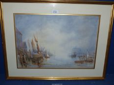 A framed and mounted well-executed Watercolour depicting a misty river scene with barges,