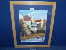 A framed and mounted Watercolour depicting a coastal village with a small boat moored in the