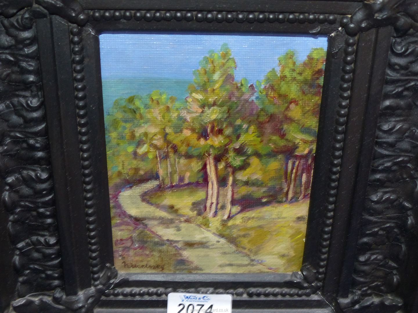 A heavily carved framed Oil on board depicting a path leading through woodland, - Image 2 of 5