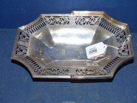 A large Victorian Silver octagonal footed pierced work Basket with floral and arch pattern panels,