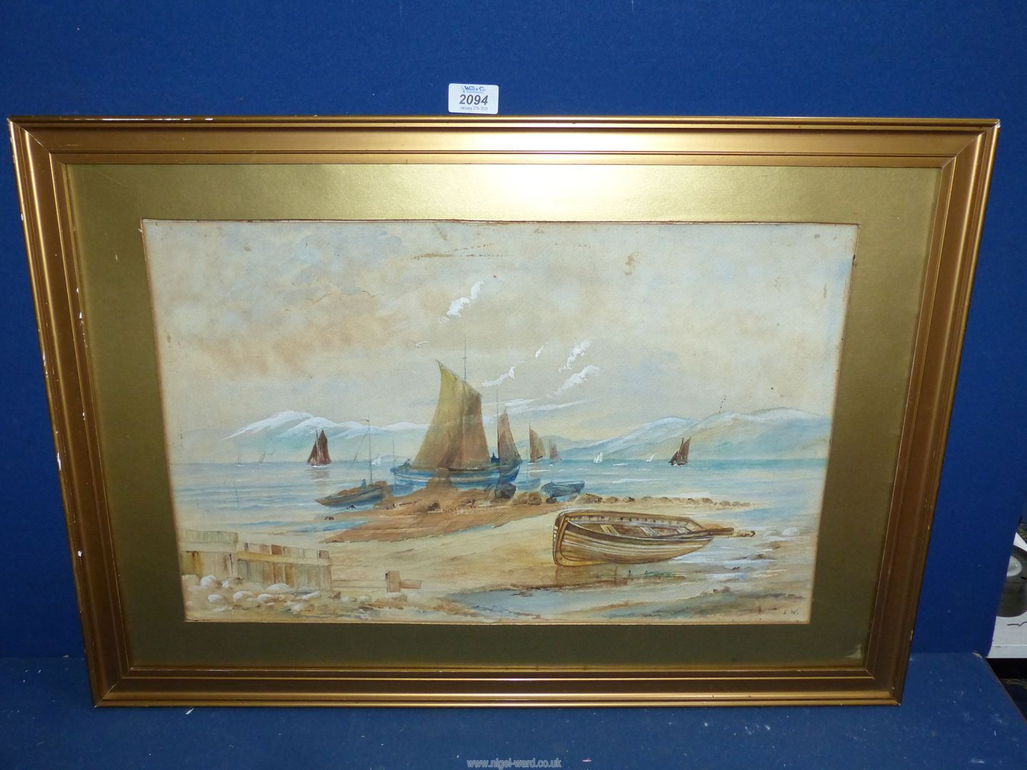 A framed and mounted (but unglazed) Watercolour of a seascape with sailing boats and rolling hills