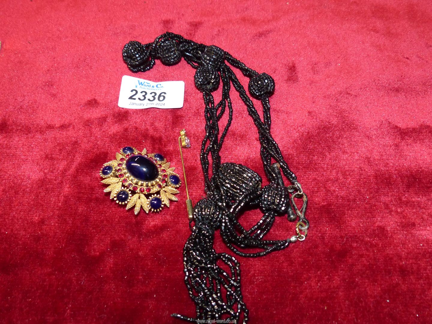 A black bead evening necklace, costume brooch with dark blue polished stones, - Image 2 of 3