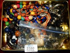 A quantity of beaded costume jewellery including necklaces, wooden bead bracelet, etc.