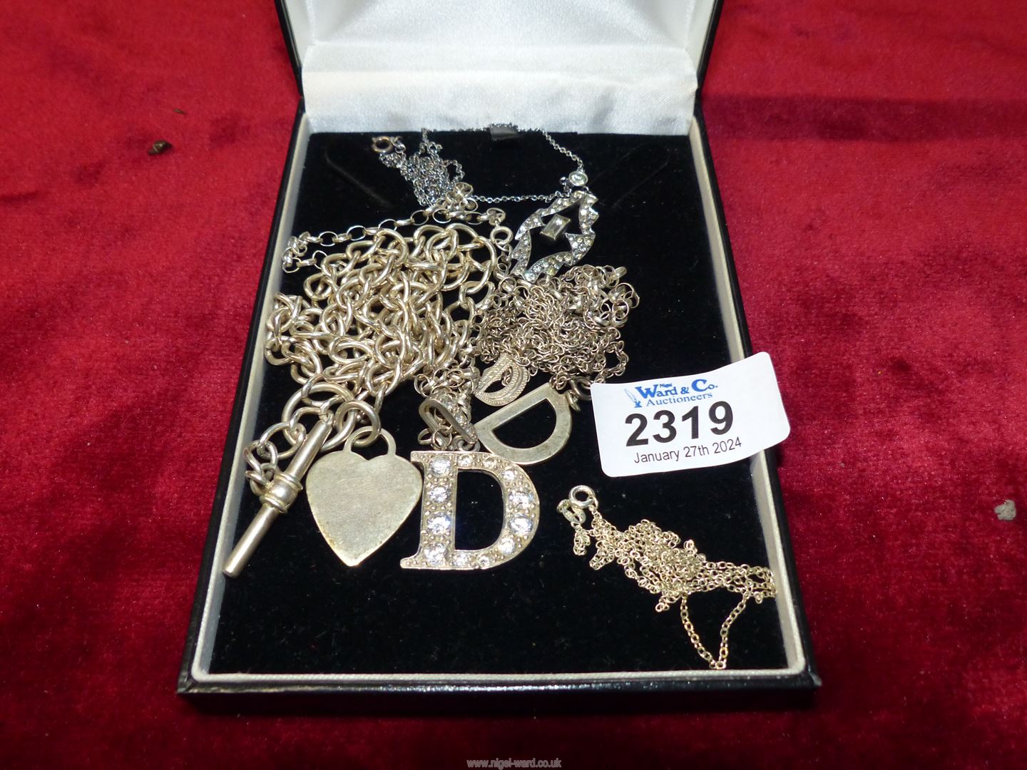 A quantity of 925 silver chains and pendants including three with 'D' monogram,
