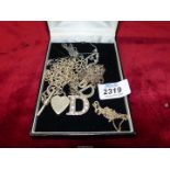 A quantity of 925 silver chains and pendants including three with 'D' monogram,