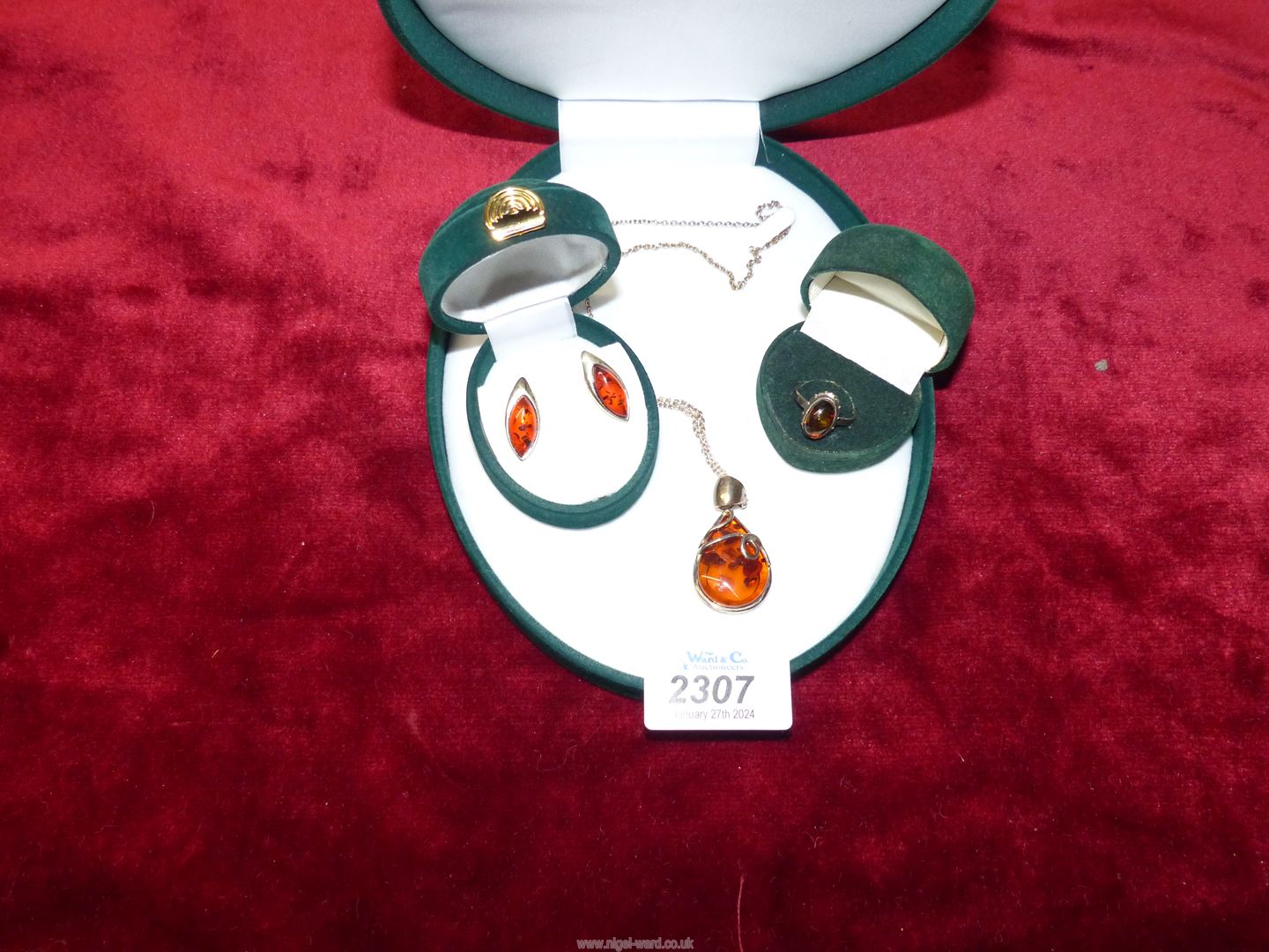 A silver and amber effect pendant, chain and earring set and a 925 silver and amber ring,
