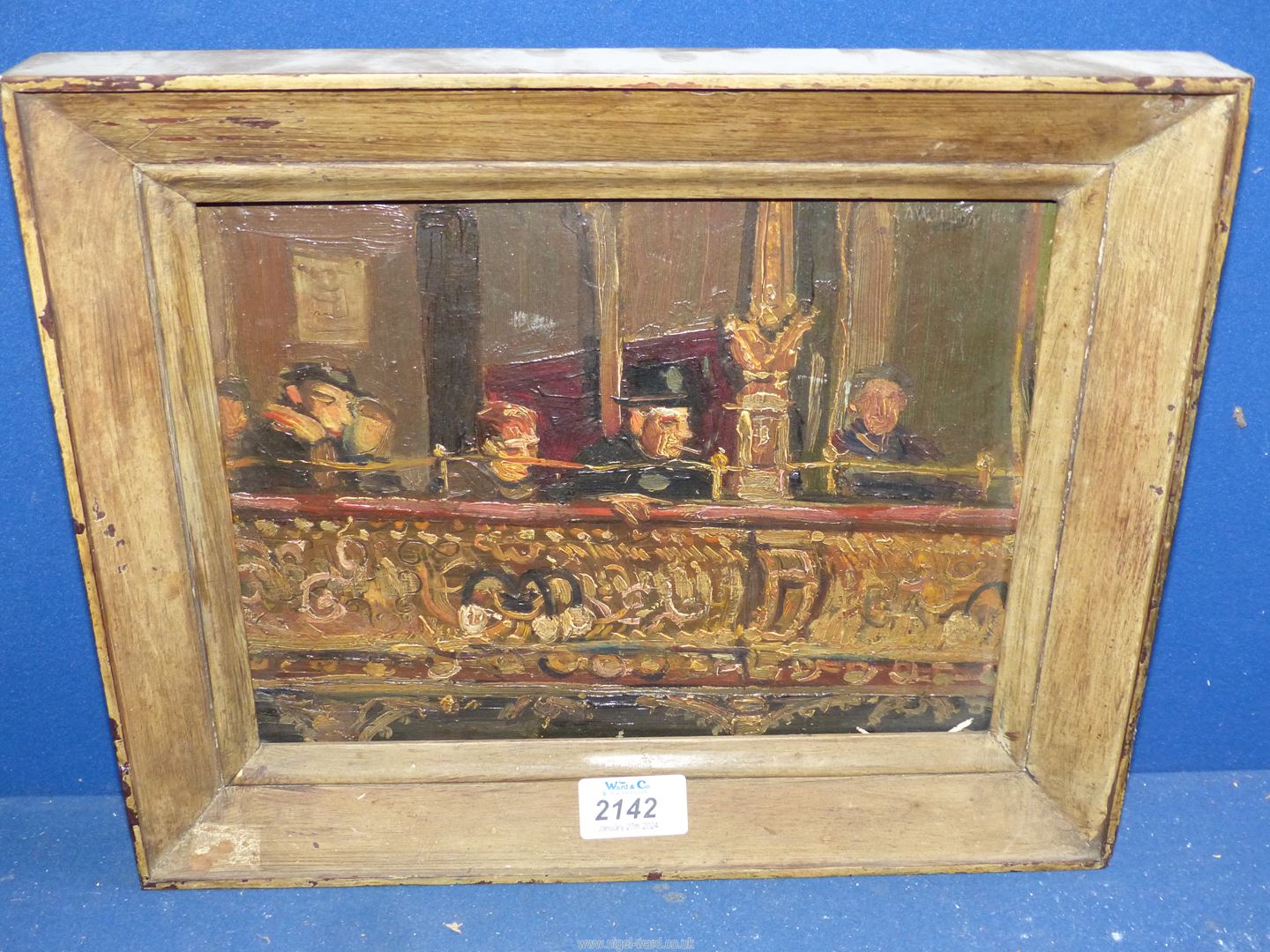 A wooden framed Oil on panel depicting a private box/balcony in a music hall with seated figures,