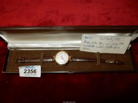 A presentation cased K18 gold cased wristwatch Swiss made for Pearce & Sons, Leicester,