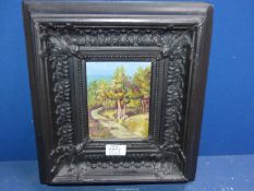 A heavily carved framed Oil on board depicting a path leading through woodland,