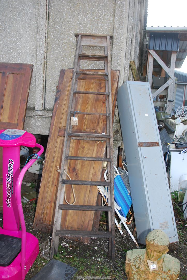 A ten rung wooden step ladder.