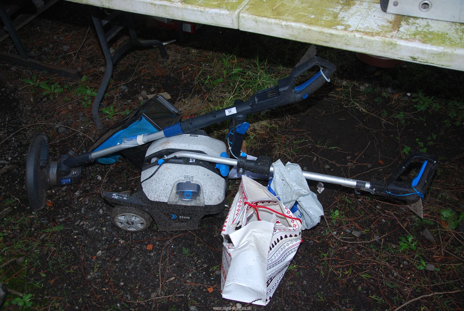 A MacAllister strimmer and lawn mower.