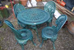 An Aluminum green painted table and 4 chairs - 31½" depth x 26½" high.