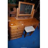 A pine dressing table with table top mirror.