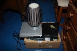 Two DVD players and a lamp.