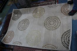 A wool rug 180 x 120 cms.