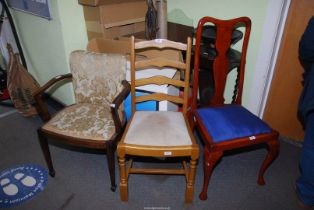 Two chairs and an upholstered chair.