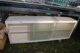 A kitchen cupboard - 49" wide x 10" depth x 18" high.