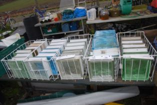 Five baskets of glass bricks - 7½" square (some plain, blue and green.).