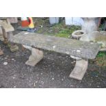 A concrete Bench having dolphin feet, 53'' wide x 15'' deep x 17 1/2'' high.