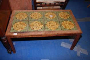 An oak tiled top coffee table, 35 1/2" x 19 1/2" x 17" high.