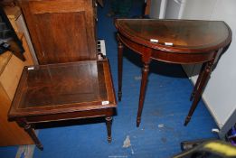 Two occasional tables with glass protective tops (demi-lune and rectangular).