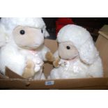 A box of two large sheep with lambs.