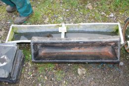 A small galvanised 53½" x 10" feed trough and a plastic feeder trough 34".