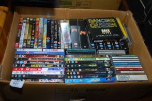 A box of DVD's and CD's.