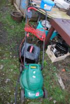 A Qualcast electric lawn mower with grass box.