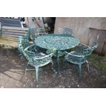 An aluminium green painted 'Jardine Leisure' patio table, 39'' diameter x 26'' high and four chairs.