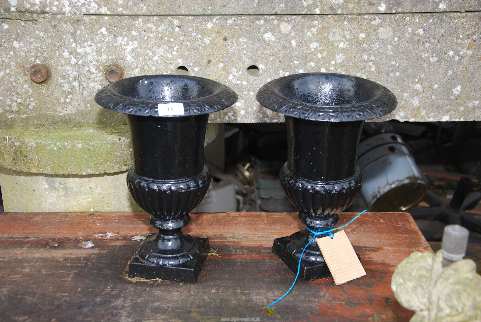 A pair of black cast iron Planters, 13 1/2'' high x 10'' diameter.