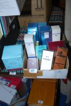 A box of used and unused perfume, etc.