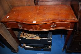A cross-banded Yew-wood two drawer hall table with serpentine front.