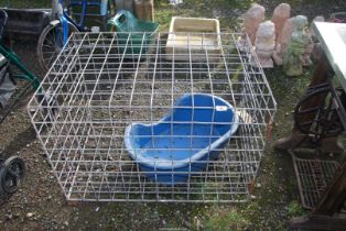A large dog cage and a dog basket.
