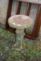 A concrete bird bath, 26 1/2'' high.