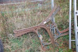 A pair of cast iron bench ends.