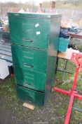 A Green metal filing Cabinet.