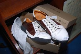 A pair of leather brogue style trainers marked Louis Vuitton, size 8/9.