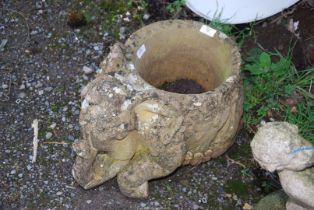 A concrete Elephant planter.