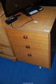 A bedside Chest of drawers.