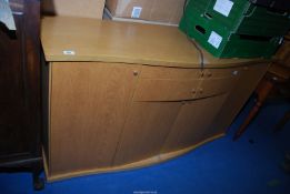 A light oak bow fronted sideboard, 61 1/2'' x 18'' x 34'' high.